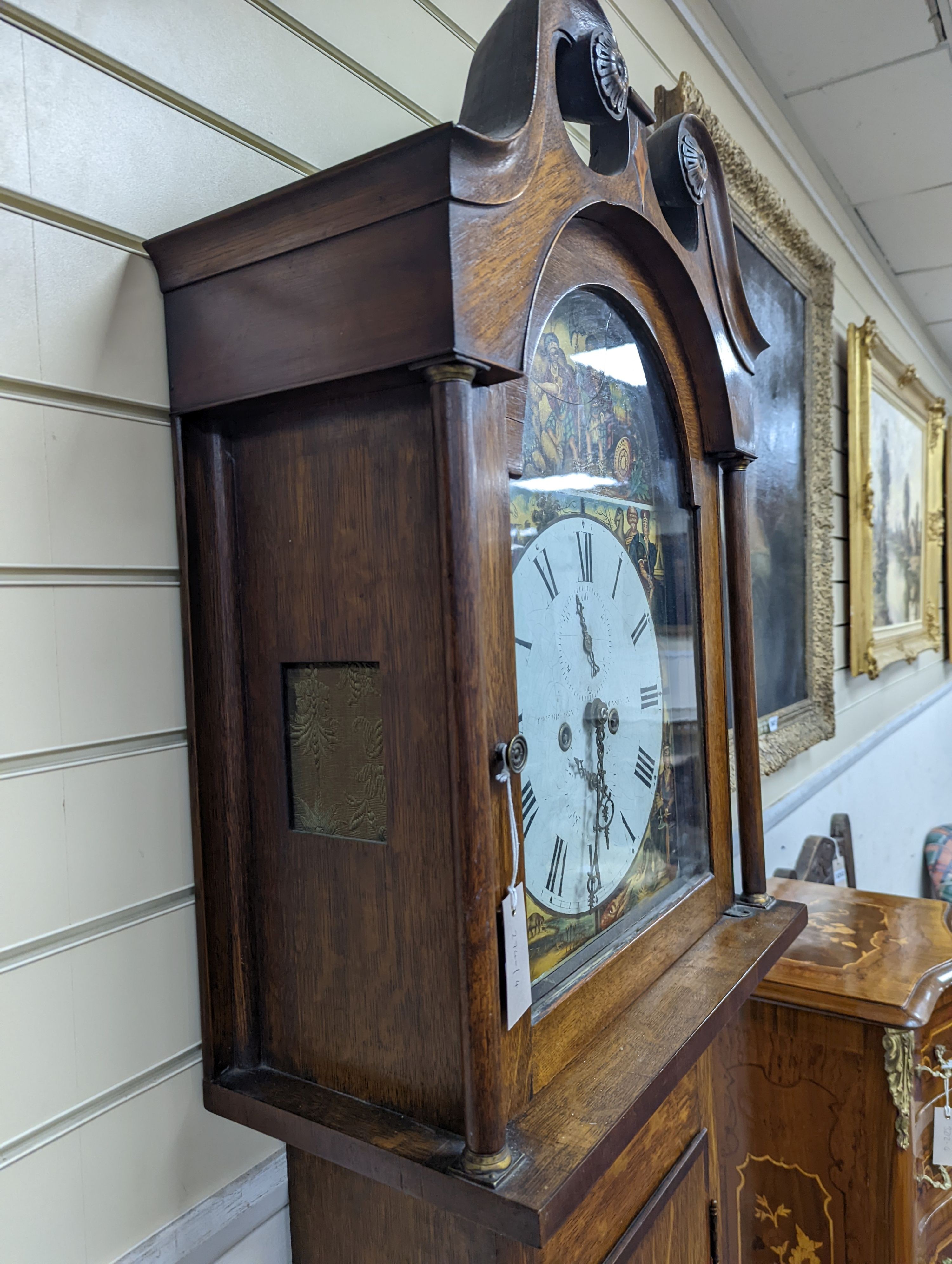 An early 19th century oak 8 day longcase clock, the dial painted with figures representing the continents, height 208cm
